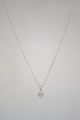 A sterling silver curb link necklace chain with bolt ring clasp, having a CZ heart drop pendant.