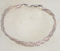A sterling silver 925 multi strand bracelet chain having a claw clasp. Weighs 9.5 grams and measures
