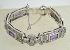 A fantastic sterling silver 925 marcasite panel bracelet having emerald cut amethyst cabochons and