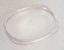 A sterling silver 925 bangle bracelet of oval form. Measure 7 cm wide and weighs 11.4 grams.