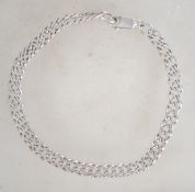 A sterling silver 925 dual bracelet chain having lobster claw clasp. Weighs 9.9.grams and measures 8