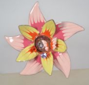 A large 1960s/70s enamelled copper flower brooch with rhinestones having a rollover catch.