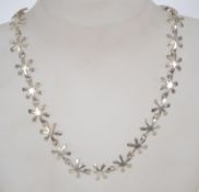 An unusual sterling silver 925 star link necklace chain, having a toggle clasp. Measures 16 inches