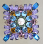 A huge Joan Rivers rhinestone brooch pin set with blue, purple, pink and green layers with central