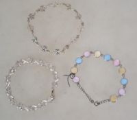 A group of three sterling silver 925 bracelets one being of x link form with a lobster claw clasp,