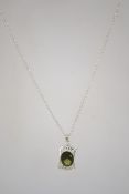 A silver pendant on chain set with an oval faceted green stone. Marked 925 to both pieces measures