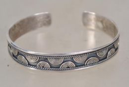 A contemporary sterling silver bangle bracelet marked 925. Weighs 18.9 grams.