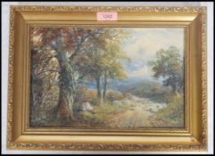 A 19th century oil on panel impressionist painting of a boy and dog beneath tree near wooded track