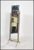 A vintage 20th century brass column form Cheval mirror,  the rectangular brass framed mirror