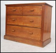 An early 20th century 1920's oak square fronted walnut cottage chest of two short over three long