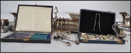 A collection of vintage 20th century silvered plated wares to include cased fruit knives, cased