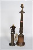 A vintage early 20th century lamp base of tapering column form raised on pedestal plinth base