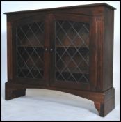 A Regency style stained pine display cabinet havin