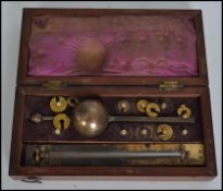 An early 20th century Sykes Hydrometer with an ivory thermometer, housed within a fitted mahogany