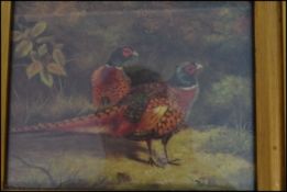 A 20th century antique still life print of a brace of pheasants. Finished to give the effect of an