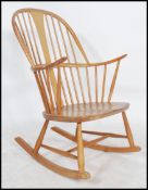 A vintage Ercol beech and elm Windsor rocking chair - armchair in Golden Dawn. Sleigh runners with