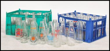 A collection of vintage and retro advertising and plain milk bottles for Dunsford dairies dating