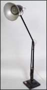 A 1940's Industrial pre-war Herbert Terry anglepoise lamp, raised on a cast metal two step base with