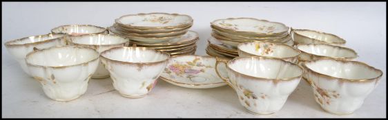 A late 19th / early 20th century bone China hand painted floral tea service consisting of trio's,