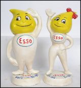 A pair of vintage cast iron advertising point of sale Esso money banks in the form of lemon headed