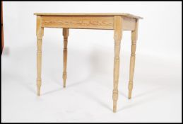 A 19th century Victorian scrubbed pine console / hall table  having a fitted frieze with a flared