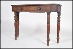 An early 19th century demi-lune mahogany  and ebony strung inlaid two drawer console table raised on