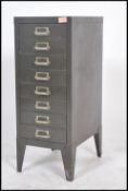 A vintage / retro industrial upright metal eight short drawer filing cabinet, shaped supports having