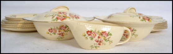 A Swinnertons harvest pattern dinner service consisting of tureens, plates, gravy boat etc. Makers