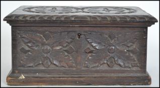 A 19th century Jacobean revival carved oak box, hav