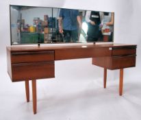 A 1970's retro teak wood dressing table having ped
