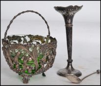 A hallmarked silver solifleur single stem vase raised on a circular base with a tapering knopped