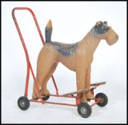 An original mid century Triang childs push along -