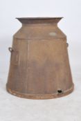 A large early 20th century agricultural farm VAT of pressed metal form having a wooden base with