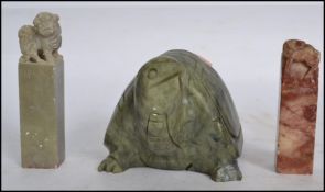 Three pieces of Chinese carved soapstone to include two pieces in the form of seals and the other