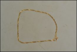 A 9ct gold chain bracelet marked 375 having a spring hoop clasp. Measures 17cms.