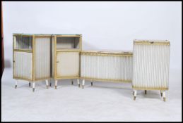 A Lloyd Loom style 1950's suite of furniture to include a pair of bedside cabinets, ottoman