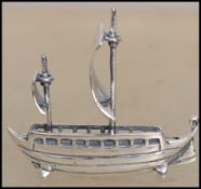 An unusual silver model of a Viennese sailing ship having twin masts with billowing sails. Total