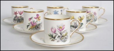 A Royal Worcester coffee can service having a decorative chintz pattern comprising cups, saucers etc