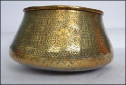 A vintage 19th century Turkish / Islamic brass planter pot of tapering form having circular