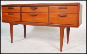 A vintage / retro 20th century teak wood G plan sideboard having a series six drawers raised on