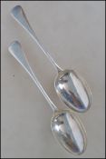 A pair / set of 2 19th century Georgian silver table spoons bearing London hallmarks date letter