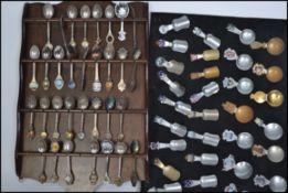 A very large collection of collectors teaspoons to include several enamel spoons. Many spoons from