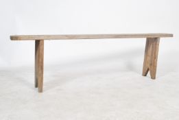 A  19th century French refectory pig bench. Having shaped single plank top of pine construction