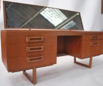A 1970's retro teak wood dressing table in the man