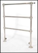 Architectural Salvage. An early 20th century towel radiator. Of tubular form with floor brackets and