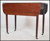 A 19th century mahogany drop-leaf Pembroke table of rectangular form, with triple-reed edge,