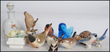 A good group of miniature ceramic animals to include a Royal Worcester 3238 Bullfinch, wrens,