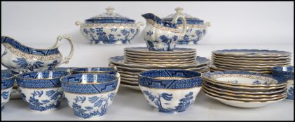 A collection of 20th century blue and white ' Real Old Willow ' by Booth's, to include trio's,
