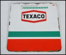 A retro 1970's single sided advertising sign for Texaco showing conversion chart for Litres and