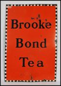 A vintage 20th century large enamel advertising point of sale sign for Brooke Bond Tea, black